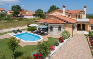 an aerial view of a house with a swimming pool at Villa Morena in Buje