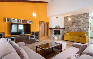 a living room with a couch and a tv at Villa Morena in Buje +41 photos