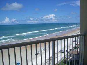 a balcony with a view of the beach and the ocean at Emerald Shores Hotel - Daytona Beach in Daytona Beach