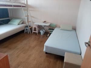 Rúm í herbergi á Ocean House - Pyeongtaek 2