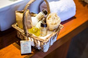 a basket of cosmetics sitting on a table at Alwa Hotel Boutique Standard in Arequipa