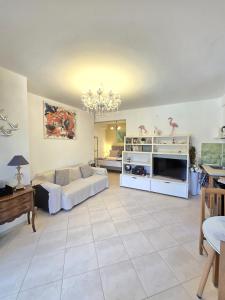 a large living room with a couch and a table at Okeanis Apartments & Suites Adults Only in Katelios +54 photos