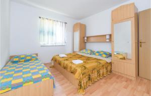 Postel nebo postele na pokoji v ubytování Cozy Apartment In Vidalici With Wifi