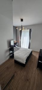 Ένα ή περισσότερα κρεβάτια σε δωμάτιο στο Cozy stay near Ialomita River