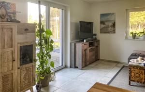 Televízia a/alebo spoločenská miestnosť v ubytovaní Ferienhaus In Feldbach