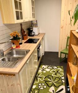 a kitchen with a sink and a counter top at Panoramic Fjord View near Bergen in Bergen