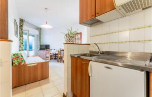 a kitchen with a sink and a counter top at Bilo 5 in Orbetello