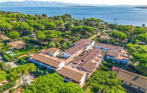 an aerial view of a house with trees and the water at Bilo 5 in Orbetello