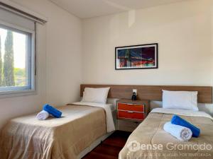 Ένα ή περισσότερα κρεβάτια σε δωμάτιο στο Belluno Boulevard Canela