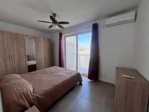 Ένα ή περισσότερα κρεβάτια σε δωμάτιο στο Newly Listed Penthouse in Msida