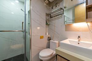 Koupelna v ubytování Hantao AI Select International Apartment + 33 fotografií