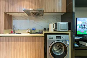 Η κουζίνα ή μικρή κουζίνα στο Hantao AI Select International Apartment