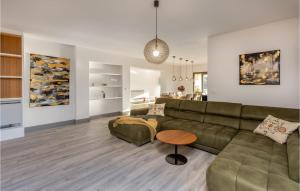 a living room with a couch and a table at Awesome Home In Boljun With Wifi in Boljun