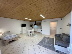 a living room with a couch and a table at Ferienwohnungen Schiffmann in Pressath