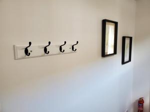 a shelf with a sign that reads music on a wall at Ipswich Town Centre Apartment 8 in Ipswich