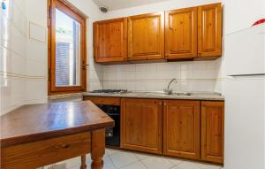 Kuchyň nebo kuchyňský kout v ubytování Cormorano