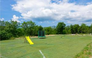 an empty field with two nets and a playground at Nice Home In Zavojane With Kitchen in Zavojane