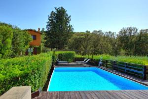 a swimming pool in the middle of a yard at Casale Argentario by PosarelliVillas in Porto Santo Stefano