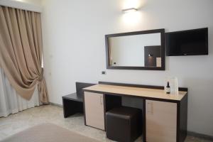 TV a/nebo společenská místnost v ubytování Hotel Boomerang Roma