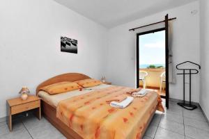 Postel nebo postele na pokoji v ubytování Apartments Nikola