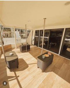 a large living room with furniture and large windows at Sail & Stay in Castillo de Sabinillas +2 photos