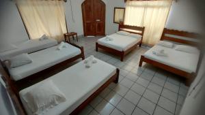 Postel nebo postele na pokoji v ubytování Hotel Ometepetl
