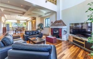 a living room with a couch and a fireplace at Beautiful Home In Banjole in Banjole