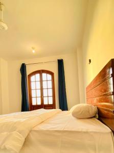 Letto o letti in una camera di villa Sun Wing - Guest House