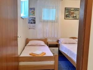 Posteľ alebo postele v izbe v ubytovaní Apartment Gordana