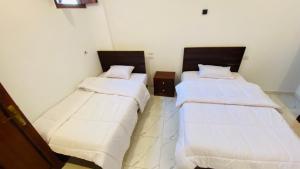Letto o letti in una camera di villa Sun Wing - Guest House