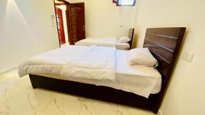 Letto o letti in una camera di villa Sun Wing - Guest House