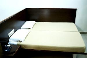 Postel nebo postele na pokoji v ubytování chiranthlodge