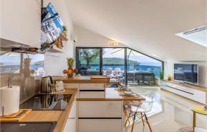 an open kitchen with a view of the ocean at Cozy Apartment In Banjole in Banjole +35 photos
