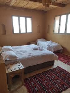 Letto o letti in una camera di Hotel Kasbah Riad Amnir