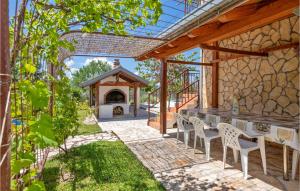 an outdoor patio with a table and chairs and a gazebo at Holiday Home Katuni 05 in Katuni +39 photos