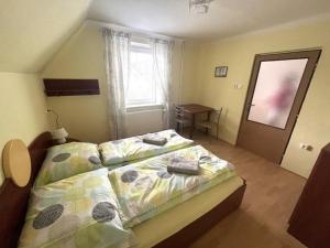 Postel nebo postele na pokoji v ubytování Domeček Mireček