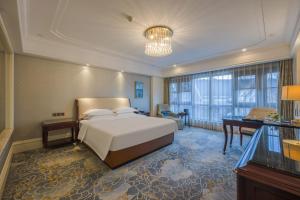 Postel nebo postele na pokoji v ubytování 康桥小镇酒店