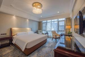 TV a/nebo společenská místnost v ubytování 康桥小镇酒店