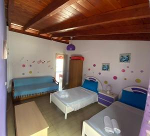 A bed or beds in a room at Nikos Studios Meltemi Family Suite Penthouse