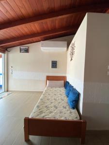 A bed or beds in a room at Nikos Studios Meltemi Family Suite Penthouse