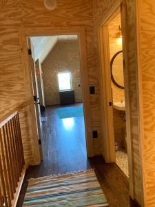 a hallway with a door open to a room at Lakefront 3BR Cabin Retreat in Samantha +42 photos