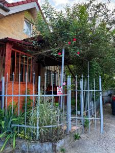 a fence in front of a house with a no parking sign at Casa Eni in Cluj-Napoca