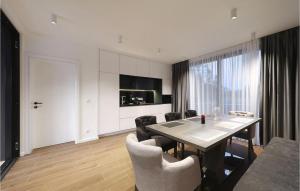 a living room with a dining room table and chairs at Villa K2 in Zadar