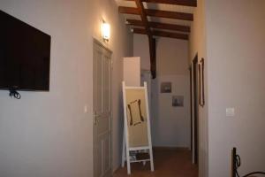a room with a flat screen tv on a wall at Villa cosy avec piscine privée - Le Gosier. in Le Gosier