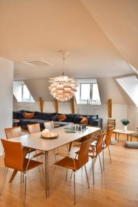 a dining room with a table and chairs at Central Penthouse with Private Rooftop Terrace in Copenhagen