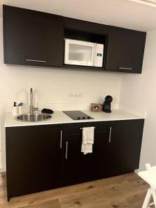 Kuchyň nebo kuchyňský kout v ubytování 2 pièces moderne et cosy à Strasbourg