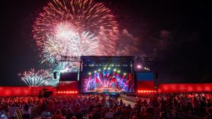 a crowd of people watching a concert with fireworks at Holiday Inn - Ottawa Dwtn - Parliament Hill by IHG in Ottawa