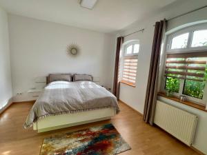 Postel nebo postele na pokoji v ubytování Villa Kayser + 37 fotografií