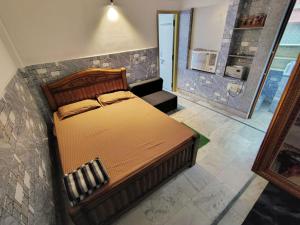 Ένα ή περισσότερα κρεβάτια σε δωμάτιο στο NIRMAN beach homestay