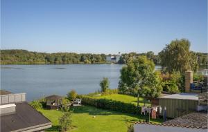 a view of a lake from the roof of a house at 1 Bedroom Gorgeous Apartment In Gråsten in Gråsten
